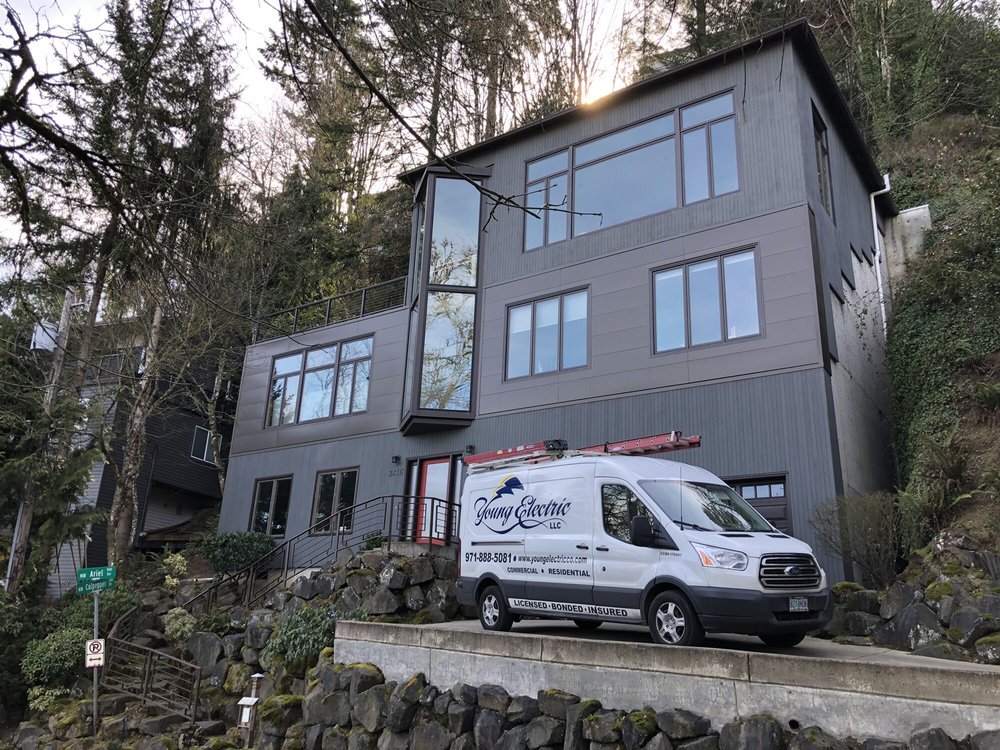 Young Electric van outside of a modern Portland home